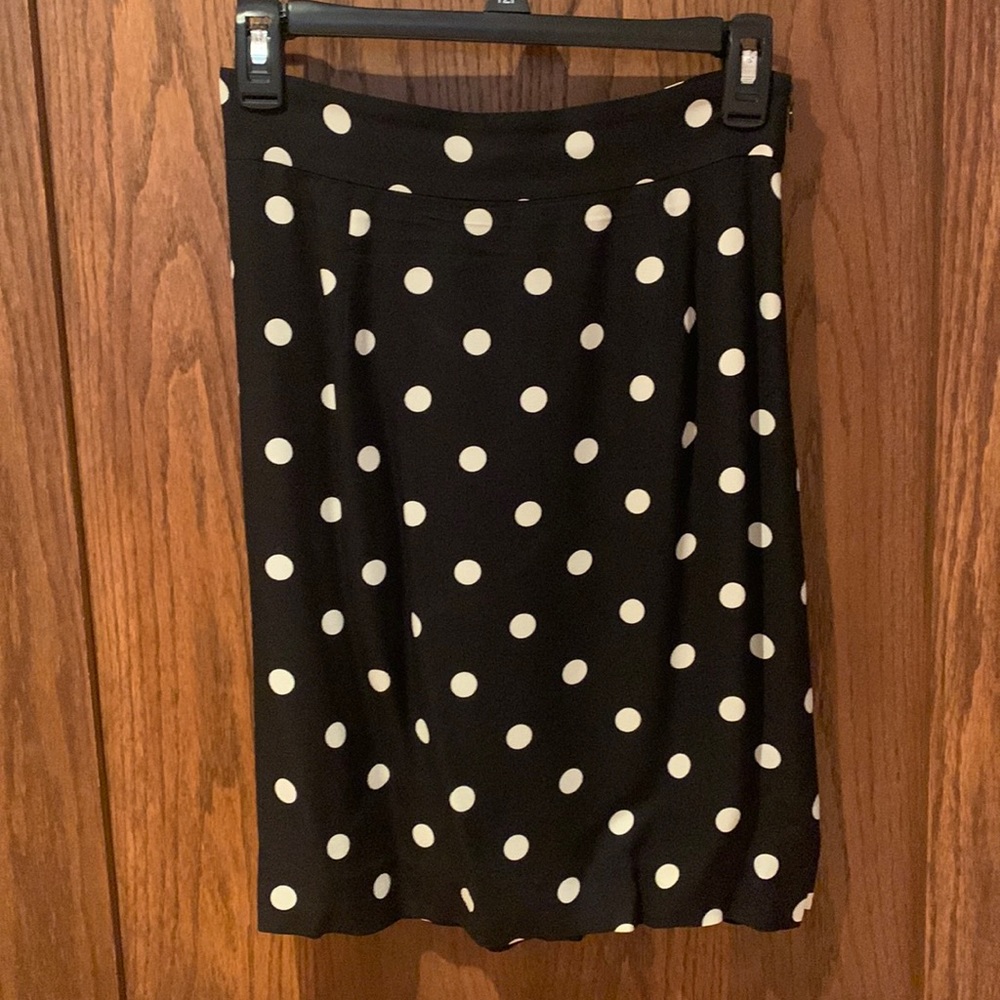 100% Silk shell, lining is 100% polyester. Size 2 skirt from the Limited